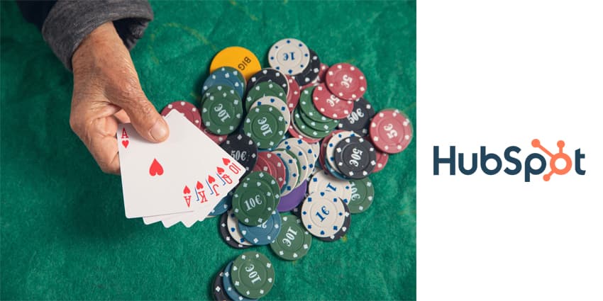 hand holding casino games chips and cards.