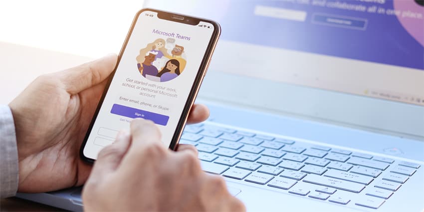 Employee enabled Microsoft Teams social platform, group chat platform app, work from home concept.