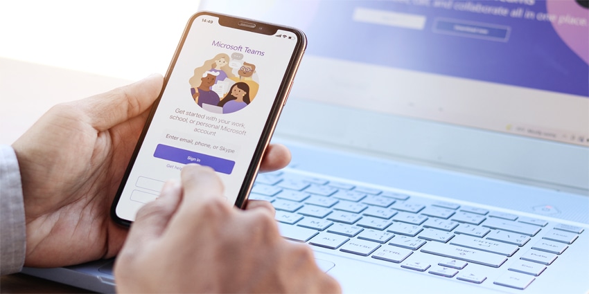 Employee enabled Microsoft Teams social platform, group chat platform app, work from home concept.