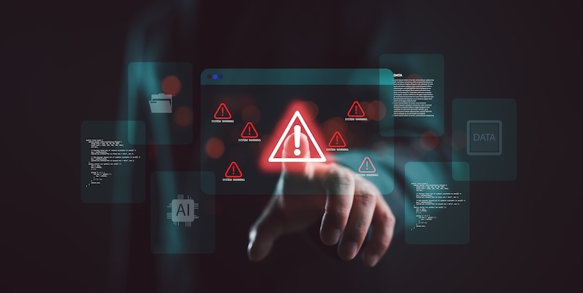 Hand interacting with digital AI warning symbols on a dark interface, highlighting automation and data risk