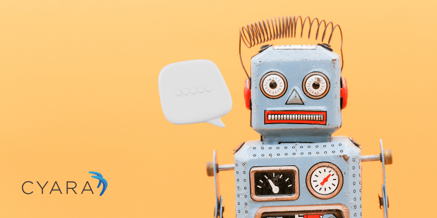 A vintage toy robot with a blue body, red ears, and a spring antenna stands against a bright orange background. A white speech bubble icon appears beside its head to represent a chatbot. The Cyara logo is displayed in the lower left corner.