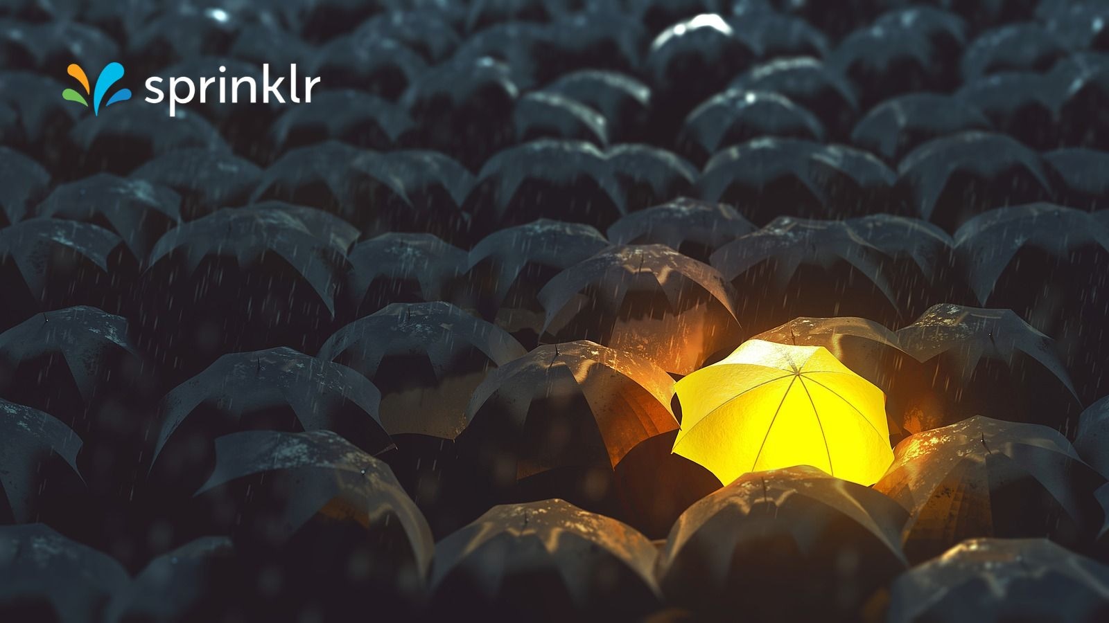 A single glowing yellow umbrella stands out among rows of dark umbrellas in the rain, with the Sprinklr logo in the top left corner