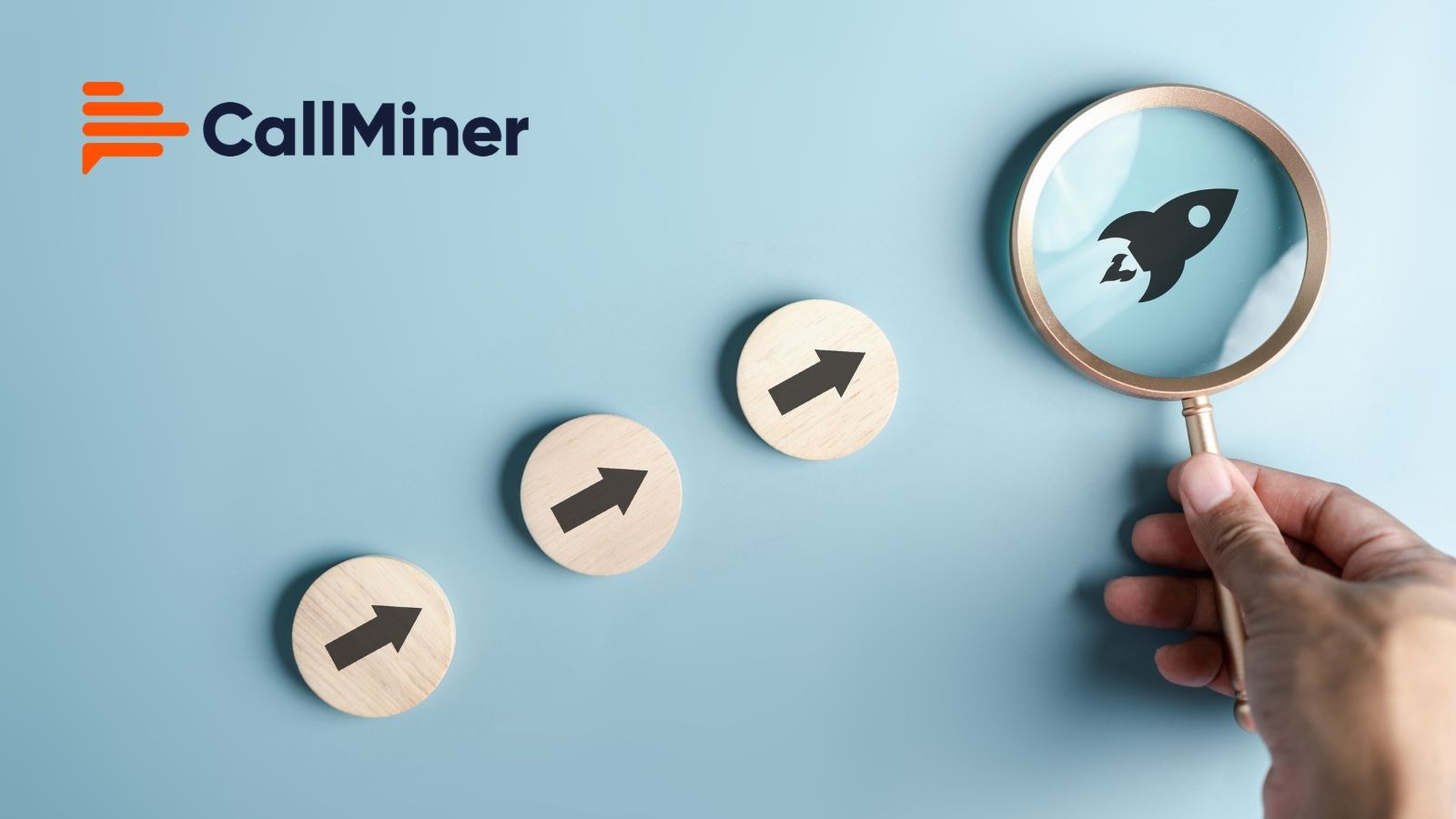 Three wooden discs with upward arrows rise in steps towards a hand holding a magnifying glass over a rocket icon, with the CallMiner logo on a light blue background